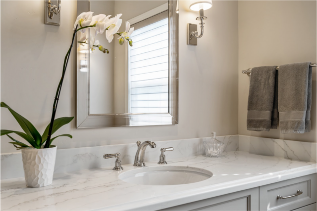 luxe-home-by-douglah-designs-lafayette-ca-2023-trends-bathroom-vanity-with-upscale-sconses-framing-the-mirror